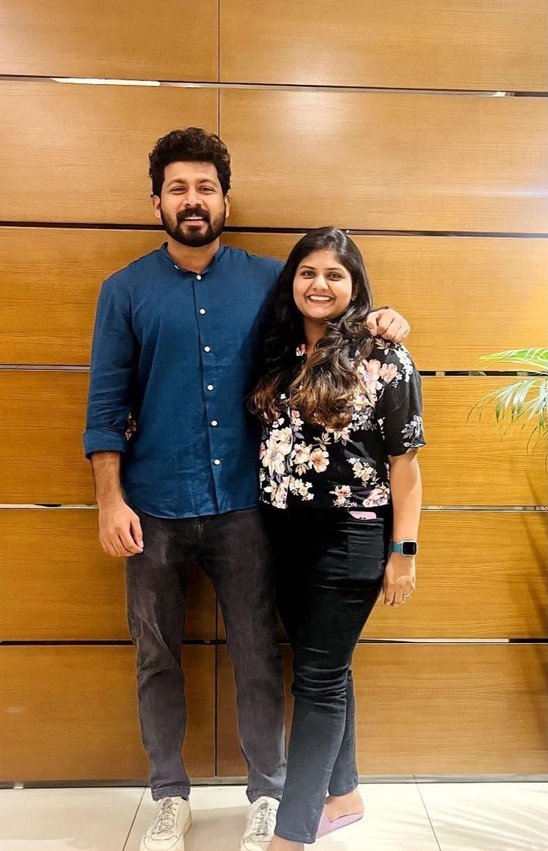 Bibin and Alicia smiling together in casual clothes